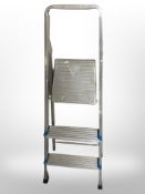 An aluminium folding step ladder