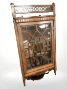 A mahogany fret work hanging glazed door corner cabinet,
