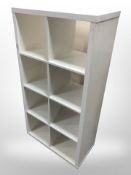 A contemporary white open cube bookcase,