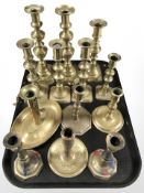 A collection of brass candlesticks