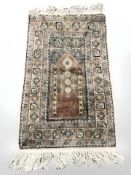 An Anatolian prayer rug with silk pile, 115 cm x 61 cm.