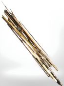 A group of vintage split cane fishing rods.