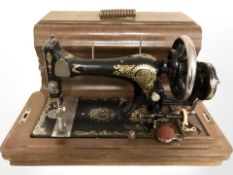 An antique hand sewing machine.