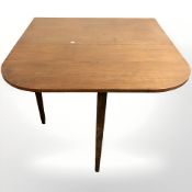 A mahogany drop leaf dining table and a set of six chairs.