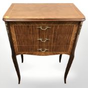 A continental king wood veneered three drawer chest, width 51 cm.