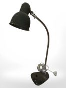 A mid 20th century enameled metal adjustable desk lamp, height 58 cm.