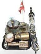 A group of brass and copper wares, desk flag pole, horse brasses on leather, swing handled couldron,