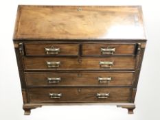 A 19th century mahogany and satinwood inlaid fall front five drawer bureau,