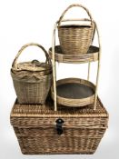A wicker hamper, two tier table and three baskets.