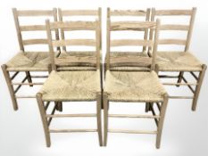 A set of six pine and rush seated farmhouse style chairs.