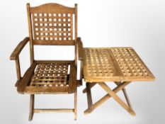 A teak folding lattice armchair and a similar occasional table.