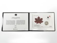 A Westminster commemorative coin cover featuring a 2007 fine silver one ounce maple leaf coin,