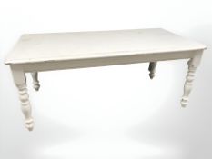 A painted pine farmhouse style dining table, 180 cm x 90 cm x 74 cm.
