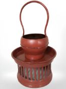 An Oriental lacquered basket and similar circular stand
