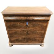 A 19th century continental walnut four drawer chest on bun feet, 92 cm x 45 cm x 91 cm.