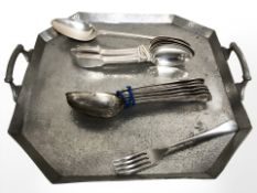 An Arts and Crafts hammered pewter twin handled tray,