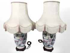 A pair of oriental style porcelain table lamps with shades, height 69 cm.