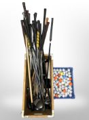 A wooden crate of golf clubs,