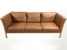 A late 20th century Danish Stouby tan leather three seater settee, 200 cm x 80 cm x 80 cm.
