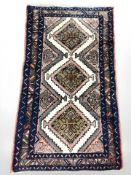 A Turkish rug on blue ground, 133 cm x 75 cm.