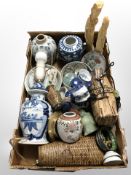 A group of oriental blue and white ceramics, wicker items, pair of resin carvings, pin dishes, etc.