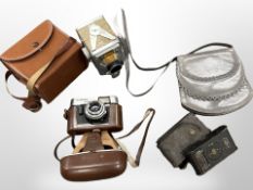 A Voigtlander Vitoret camera, a Kodak camera, one other,
