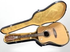 A German Hoyer acoustic guitar in hard carry case