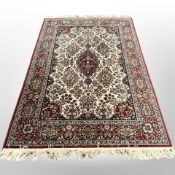 A machine-made rug of Persian design,