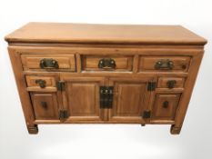 A Chinese elm sideboard, 141 cm x 51 cm x 91 cm.