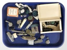 A group of lighters, whistles, folding knives, silver football fob, girl guides badges, etc.