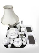 A collection of Aynsley cabinet porcelain including quartz mantle timepiece, table lamp,