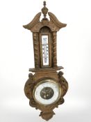 A Danish carved oak barometer.