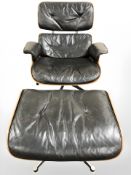 After Charles and Ray Eames : A laminated wood and black buttoned leather model 670 swivel lounge