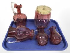 Five pieces of antique cranberry glass.