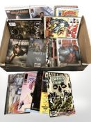 A collection of modern comic books including The Hulk, Iron Man, Frontline, Serenity, etc.