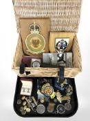A group of medals, buttons, compass, various cloth insignia, military torch,