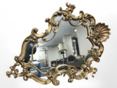 A 20th century gilt plaster Venetian style mirror, 120 cm x 85 cm.
