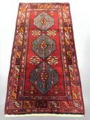 A North-West Iranian rug, 202 cm x 102 cm.