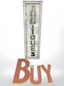 A pierced metal antiques sign, 150 cm x 43 cm,