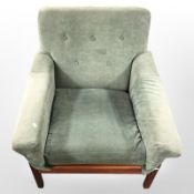A 20th century teak framed lounge armchair in green velvet upholstery,