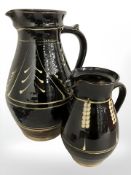 Two Coldstone slipware pottery jugs, tallest 34 cm.