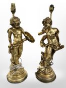 A pair of 20th century gilt plaster figural table lamps in the form of Cupid, height 48 cm.