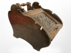 A late Victorian carved oak coal receiver,