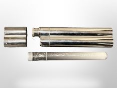 A stainless steel combination cigar / drink flask, containing a Christian of Denmark cigar in tube.