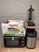 A group of culinary items including Ambiano counter top cooker, Tefal air fryer,