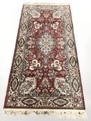 A machine made runner of Persian design, 361 cm x 91 cm.