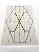 A flat weave geometric design rug,