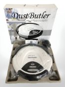 A Dust Butler floor vacuum cleaner in box.