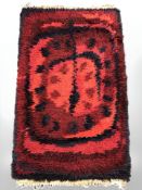 A vintage shaggy piled rug, 120 cm x 73 cm.