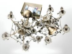 A pair of six sconce chandeliers with crystal lustres diameter 60 cm and a box of various bulbs